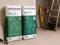 Dwa worki kleju do płytek Optolith Elastic T60 i Elastic Easy. Idealny klej do płytek ceramicznych na ogrzewanie podłogowe.